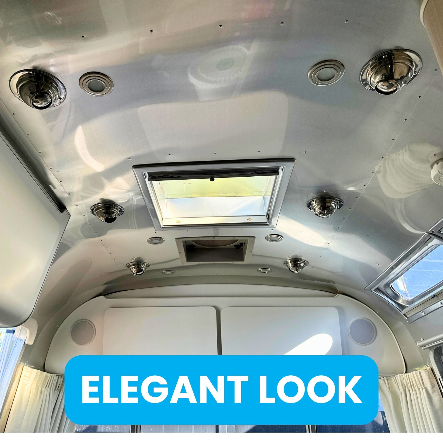 Airstream ceiling with CAMPAIR Stainless Steel Spot Diffuser installed near skylight showing elegant low-profile design
